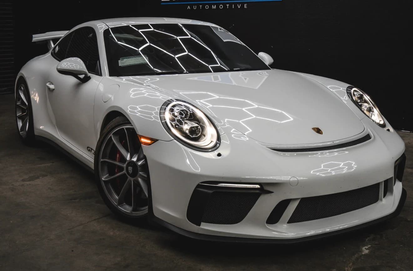 White Porsche 911 GT3 photographed inside the current Speedhaus Automotive workshop