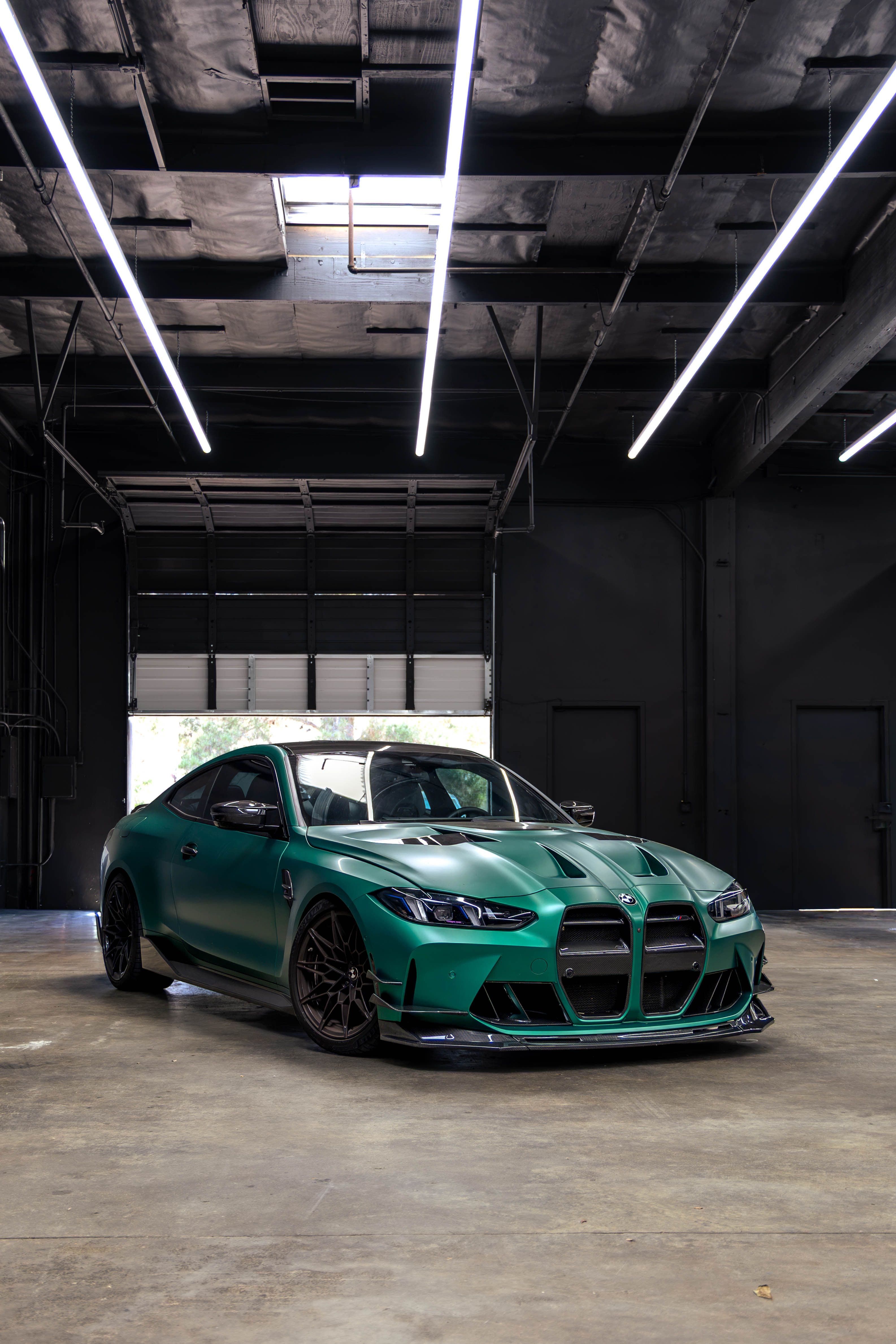 Green BMW performance build photographed inside the new Speedhaus workshop