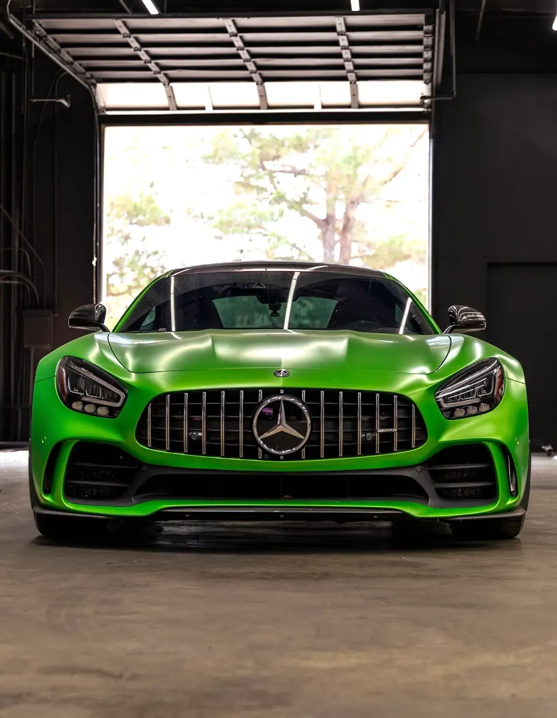 Green Mercedes-AMG GT photographed from the front inside the new Speedhaus workshop