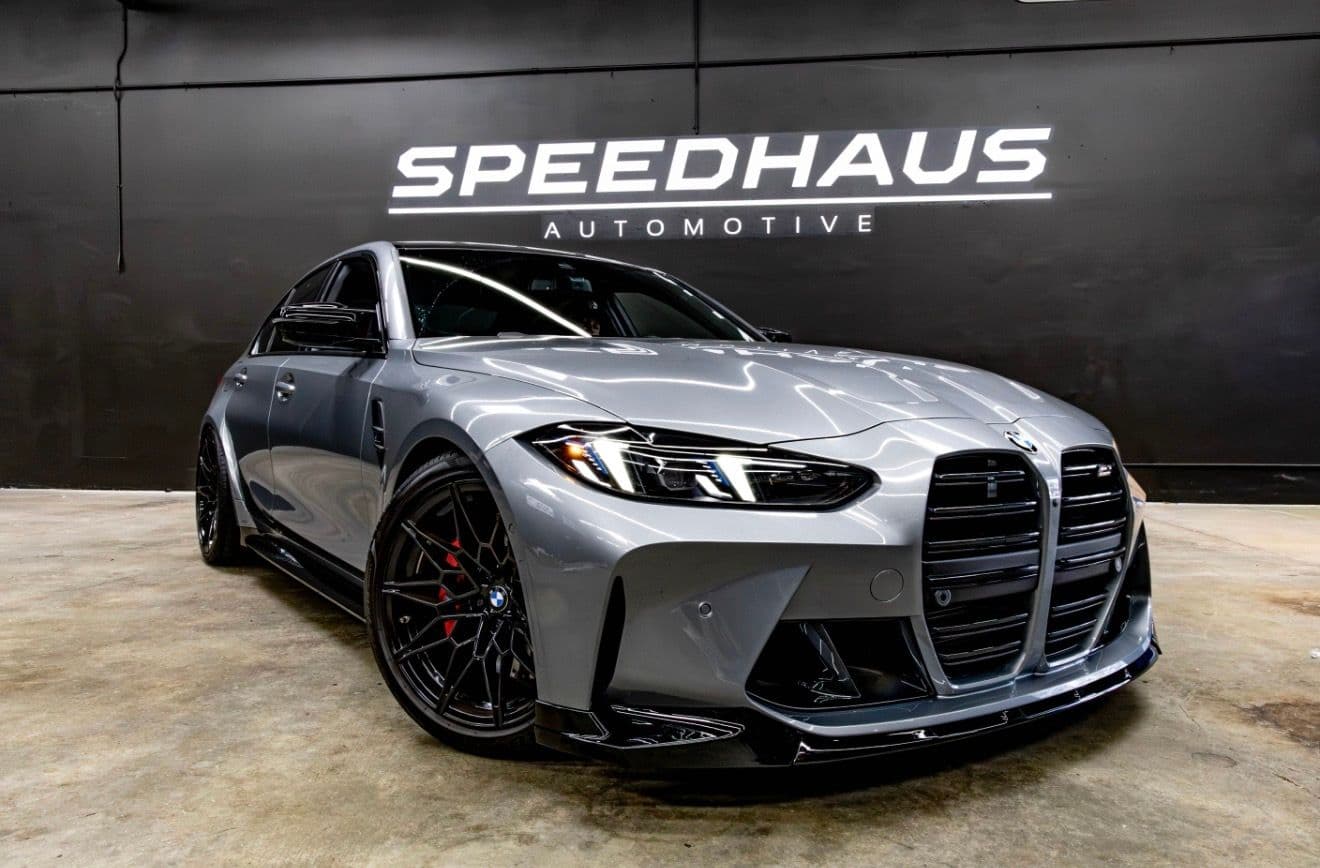 Gray BMW M3 performance sedan photographed inside the current Speedhaus Automotive workshop