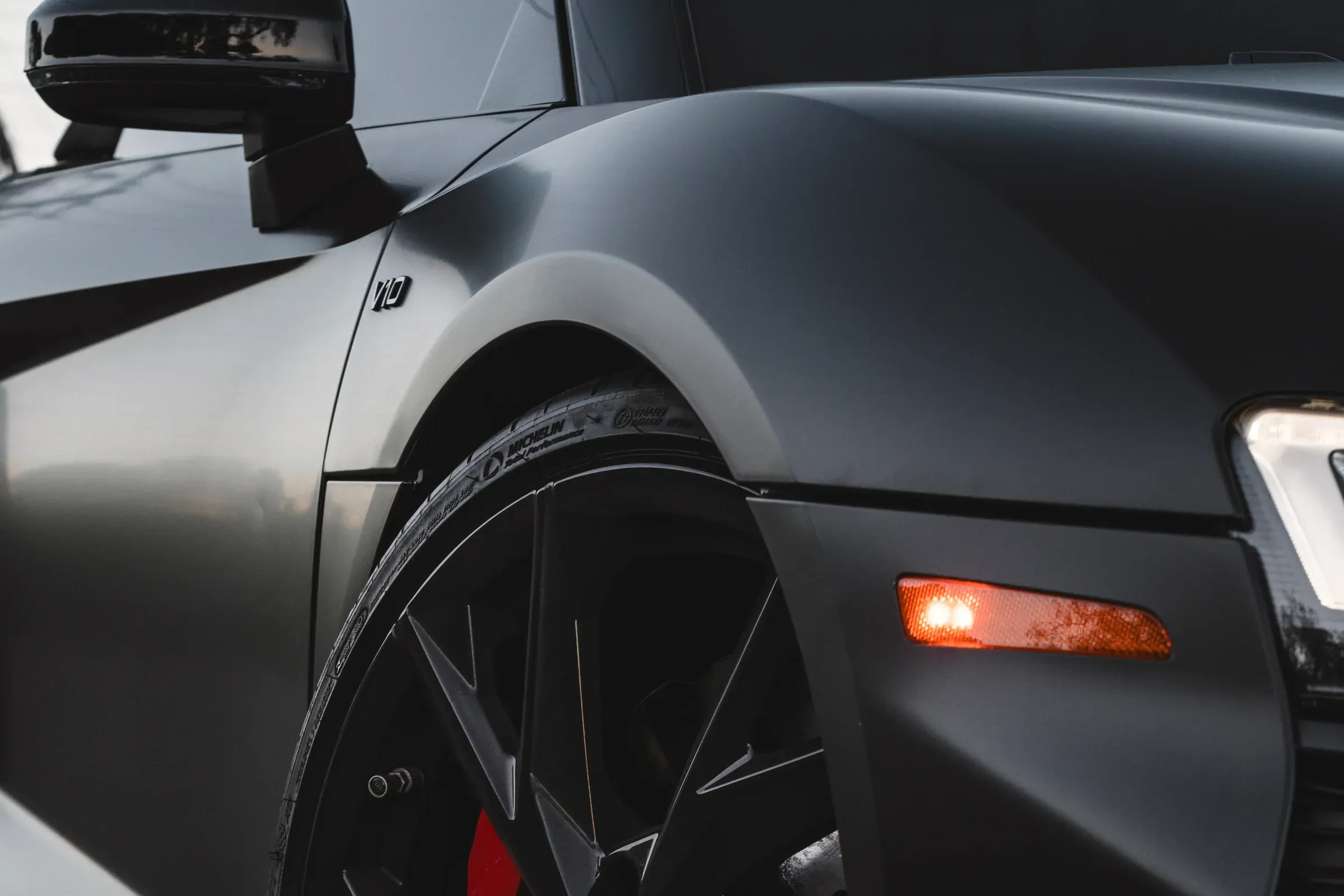 Audi wheel, tire, and brake detail photographed outdoors