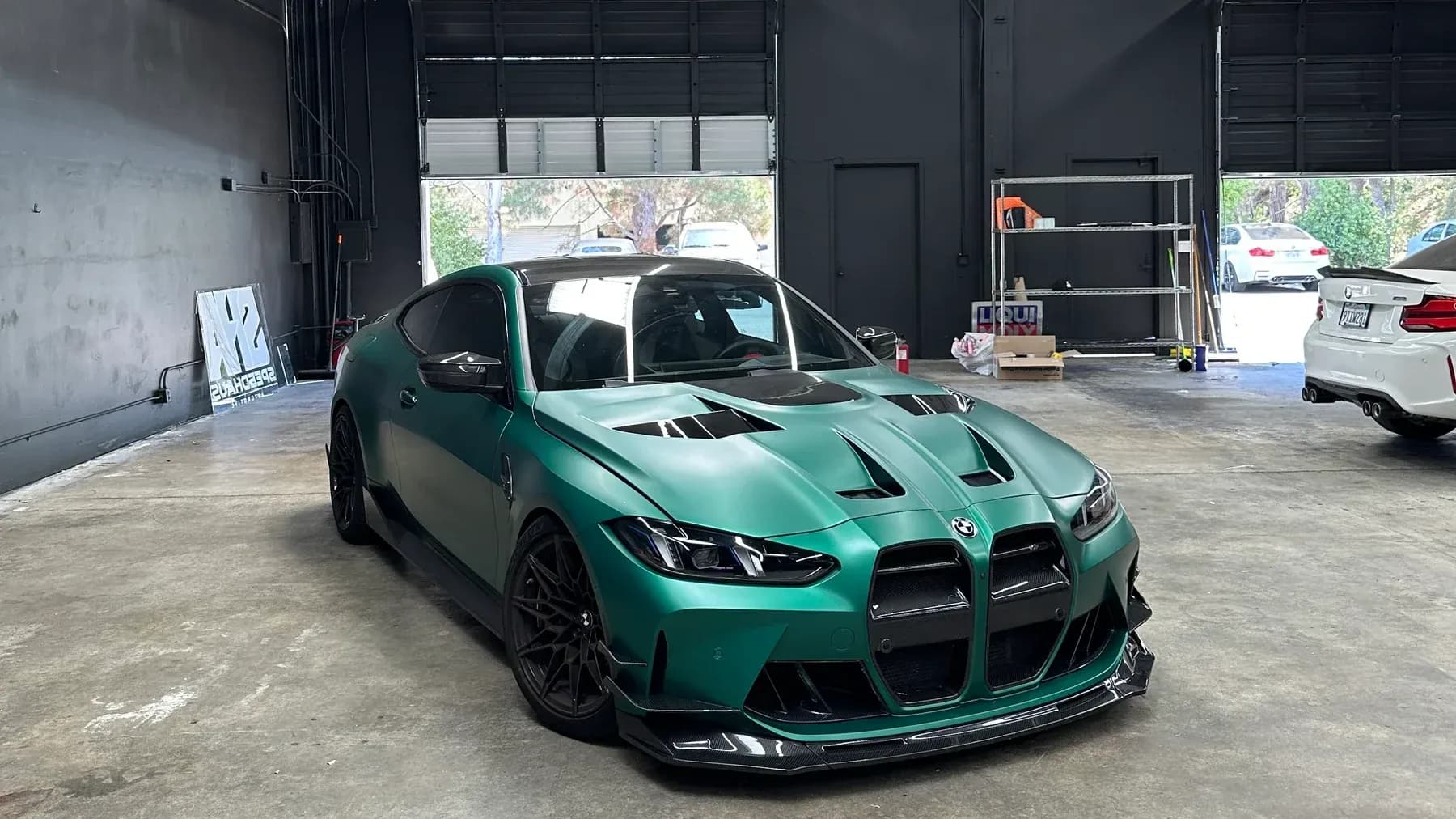 Green BMW performance build photographed inside the new Speedhaus workshop